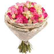 Bouquet of common and spray roses in paper