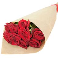 A small bouquet of red roses in paper