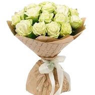 A bouquet of white roses in kraft paper