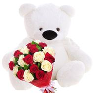 Big teddy bear and bouquet of roses
