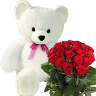 Teddy bear and red roses