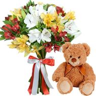 Teddy bear with bouquet of alstroemerias