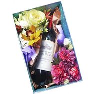 Box with flowers and wine