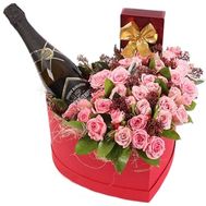 Box with roses, champagne and chocolate