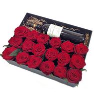 Red roses and wine in a box