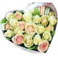 Roses and macarons in a box in the shape of a heart