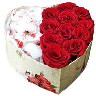 Red roses and candies in a box