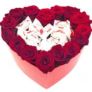 Roses and candies in a box heart