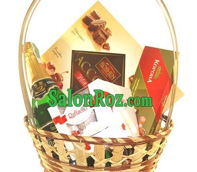 Basket with champagne and sweets Basket with champagne and sweets