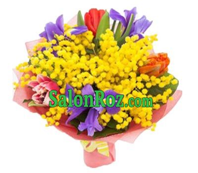 Bright bouquet of mimosa, irises and tulips Bright bouquet of mimosa, irises and tulips
