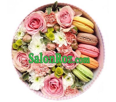 A box of flowers with macarons A box of flowers with macarons