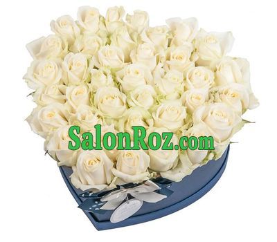 White roses in a box in the shape of a heart White roses in a box in the shape of a heart