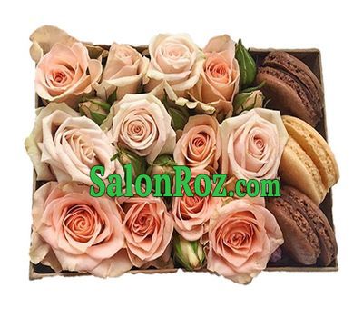 A bouquet of roses in a box with macarons A bouquet of roses in a box with macarons
