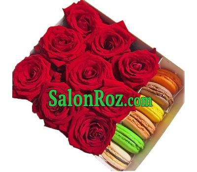 A small box with roses and macarons A small box with roses and macarons