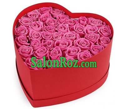 Pink roses in a box in the shape of a heart Pink roses in a box in the shape of a heart