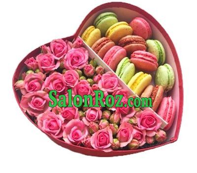 Roses and macarons in a box in the shape of a heart Roses and macarons in a box in the shape of a heart