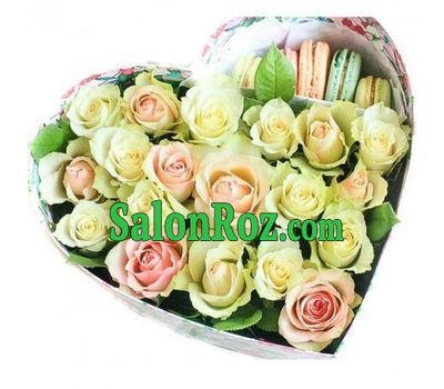 Roses and macarons in a box in the shape of a heart Roses and macarons in a box in the shape of a heart